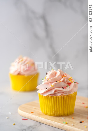 Homemade Birthday cupcake on marble Background. 62483171