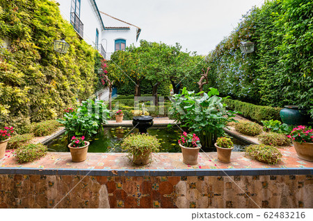 Courtyard garden of Viana Palace in Cordoba, Andalusia, Spain. Courtyard garden of Viana Palace in Cordoba, Andalusia, Spain. 62483216