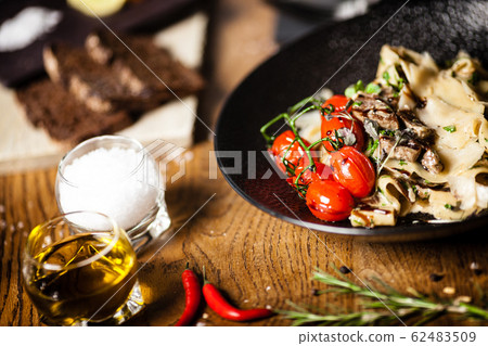 Black Angus Pasta served in a black bowl in restaurant Black Angus Pasta served in a black bowl in restaurant 62483509