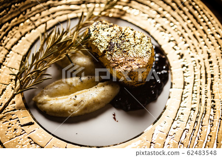 Black Angus tenderloin steak covered with 24 carat gold Black Angus tenderloin steak covered with 24 carat gold 62483548
