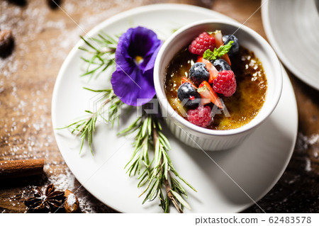 Avocado creme brulee served in a cup in restaurant Avocado creme brulee served in a cup in restaurant 62483578