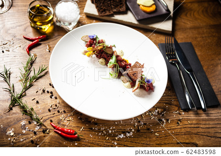 Steak tartare served on a plate in restaurant Steak tartare served on a plate in restaurant 62483598