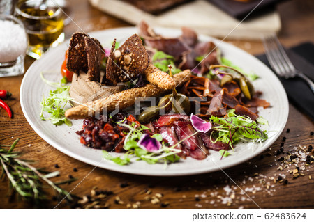 Meat platter for two served on a plate in restaurant 62483624