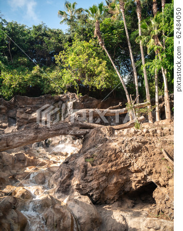 Beautiful image of water stream flowing from high mountain in tropical rainforest Beautiful image of water stream flowing from high mountain in tropical rainforest 62484050