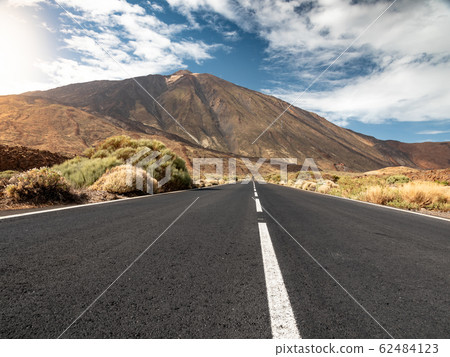 Beautiful mountain highway going through dry rocky desert to volcano Teide, Tenerife, Canary islands 62484123