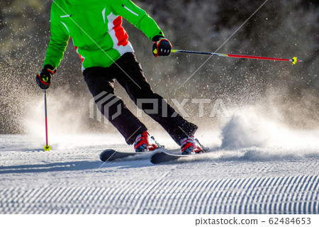 Body of skier on fresh groomed snow on slope Body of skier on fresh groomed snow on slope 62484653