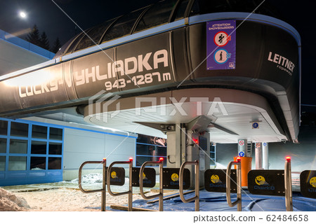 DEMANOVSKA DOLINA, SLOVAKIA - FEBRUARY 8: Empty ski lift chair at night in ski resort Jasna on February 8, 2020 in Demanovska Dolina DEMANOVSKA DOLINA, SLOVAKIA - FEBRUARY 8: Empty ski lift chair at night in ski resort Jasna on February 8, 2020 in Demanovska Dolina 62484658