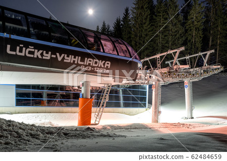 DEMANOVSKA DOLINA, SLOVAKIA - FEBRUARY 8: Empty ski lift chair at night in ski resort Jasna on February 8, 2020 in Demanovska Dolina DEMANOVSKA DOLINA, SLOVAKIA - FEBRUARY 8: Empty ski lift chair at night in ski resort Jasna on February 8, 2020 in Demanovska Dolina 62484659
