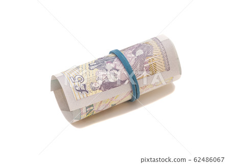 Five pounds in roll isolated Five pounds in roll isolated 62486067