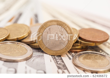 Euro coins over dollar notes Euro coins over dollar notes 62486672