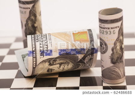 Dollar bills on a chess board 62486688