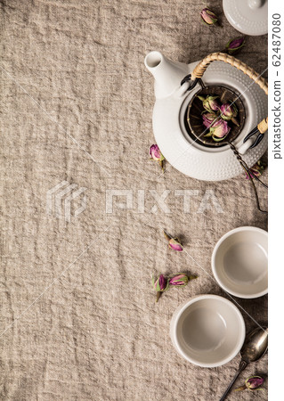 Herbal tea with roses, Making Rose buds tea flat lay Herbal tea with roses, Making Rose buds tea flat lay 62487080