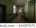 Green corridor with an empty hospital bed in an 62487472