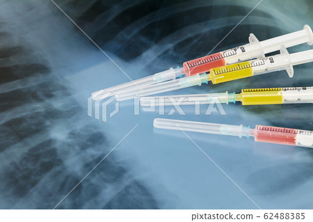 Syringes with various medicines on the background 62488385