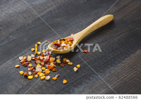 chilli powder on wooden spoon 62488566