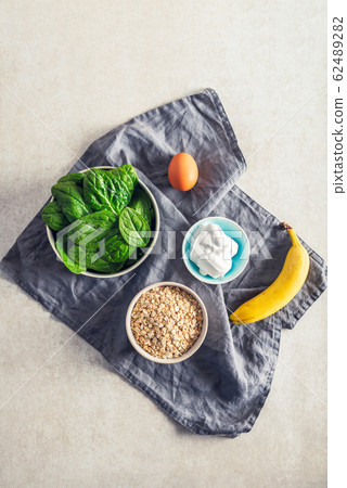 Ingredients for healthy green pancakes 62489282