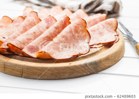 Sliced salami sausage. Smoked ham. Sliced salami sausage. Smoked ham. 62489603