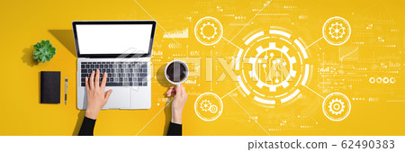 Automation concept with person using laptop computer 62490383
