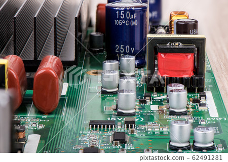 Capacitors, microcircuits and other electronic components close-up. Capacitors, microcircuits and other electronic components close-up. 62491281