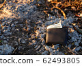 A man lost wallet on the ground 62493805