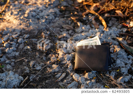 A man lost wallet on the ground A man lost wallet on the ground 62493805