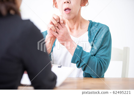 Mature woman receiving counseling Mature woman receiving counseling 62495221