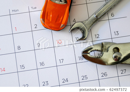 wrench and car on the calendar with numbers. 62497372