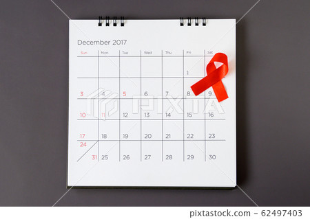 World AIDS day concept, red ribbon the date 1 62497403