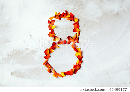 Number 8 - eight red-yellow roses laid out from a petal. Close-up. 62499177