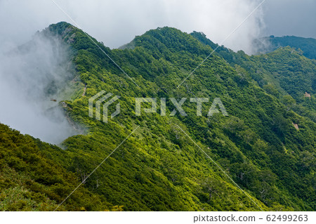 The ridgeline to Mt.Jizou where clouds spring from Iide Mountains and Mikuni-dake The ridgeline to Mt.Jizou where clouds spring from Iide Mountains and Mikuni-dake 62499263