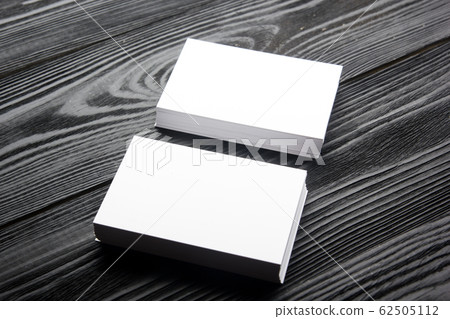 Business card blank on wooden background. Corporate Stationery, Branding Mock-up. Creative designer desk. Flat lay. Copy space for text Business card blank on wooden background. Corporate Stationery, Branding Mock-up. Creative designer desk. Flat lay. Copy space for text 62505112