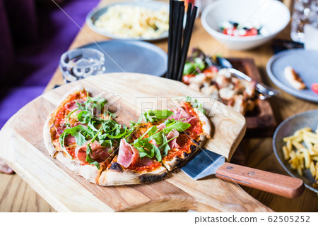 margarita pizza on the servered table in 62505252