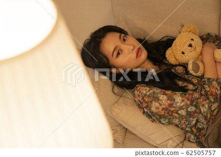 Lifestyle woman relax inside house Lifestyle woman relax inside house 62505757