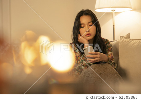 Lifestyle woman relax inside house Lifestyle woman relax inside house 62505863