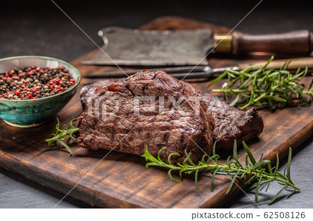 Two beef rump steaks with herbs tomatoes salt and 62508126