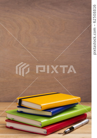 notepad or paper notebook at wooden table notepad or paper notebook at wooden table 62508816