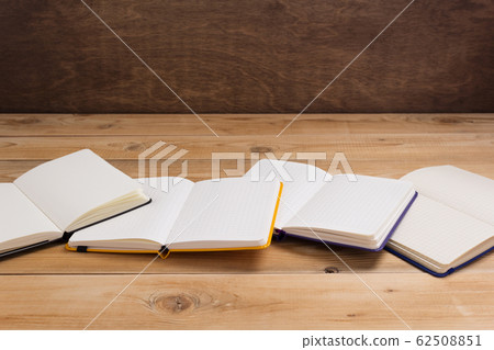 notepad or paper notebook at wooden table notepad or paper notebook at wooden table 62508851