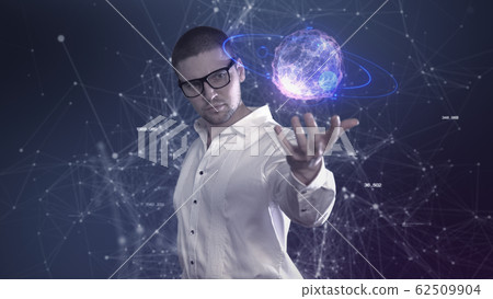 A male scientist in a white shirt holds an abstract ball in his hands against a background of plexus 62509904