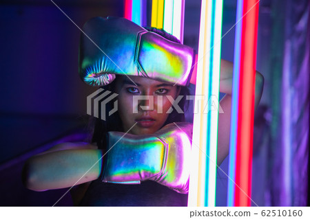 Beautiful 20s Asian Woman punch, poses with Silver Beautiful 20s Asian Woman punch, poses with Silver 62510160