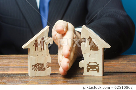 Puzzle house is divided into two equal parts by a lawyer in a divorce process. Protection of rights. Conflict resolution. Court, justice. Disputes over fair division of marital property real estate. 62510862