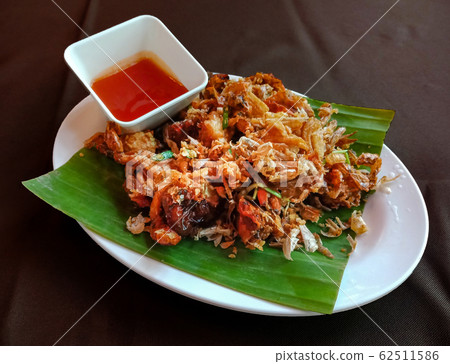 Fried Soft Shell Crab with Garlic on white plate 62511586