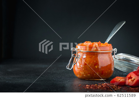 Adjika hot chili pepper sauce paste harissa Adjika hot chili pepper sauce paste harissa 62511589