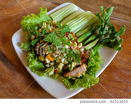 Closeup Thai spicy minced pork salad on table Closeup Thai spicy minced pork salad on table 62511633
