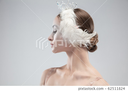 Close up of young graceful ballerina on white studio background Close up of young graceful ballerina on white studio background 62511824