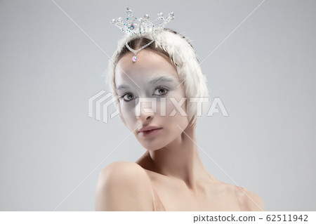 Close up of young graceful ballerina on white studio background Close up of young graceful ballerina on white studio background 62511942