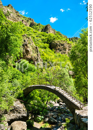 Ancient bridge at Geghard monastery in Armenia Ancient bridge at Geghard monastery in Armenia 62512590