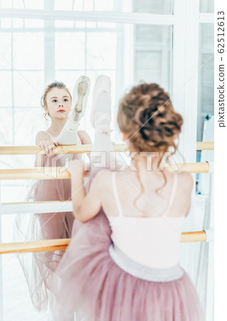 Beautiful graceful ballerina practice ballet Beautiful graceful ballerina practice ballet 62512613