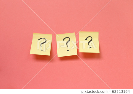 Question mark on memo paper on pink background. Solution concept Question mark on memo paper on pink background. Solution concept 62513164