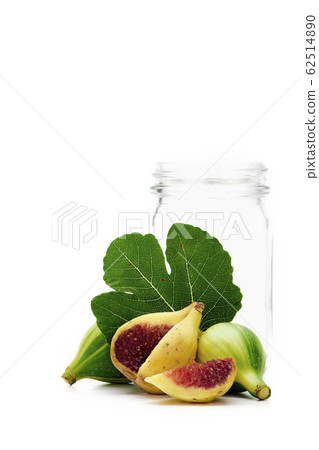 Ripe figs and Empty glass bottle on white Ripe figs and Empty glass bottle on white 62514890