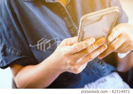 image of people using a smartphone. image of people using a smartphone. 62514972